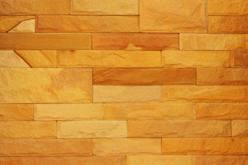 Fototapeta premium Pattern of rough sandstone wall texture for background and design.