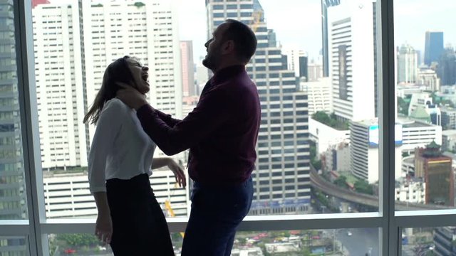 Husband murdering his wife by window at home, super slow motion 120fps