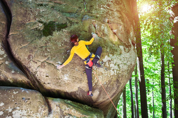 girl is climbing the rock.