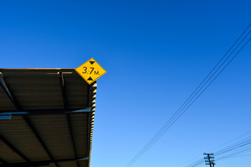 Sign height requirements at the station with blue sky