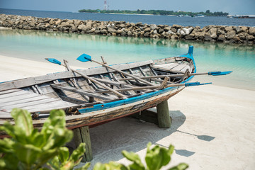 Boat on the shore of the city of Male. Maldives. Vacation. White sand.