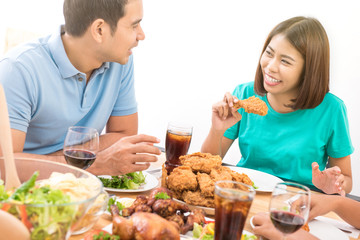 Happy Asian couple having dinner