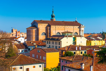 Obraz premium Old cathedral in the center of the walled city of Cittadella. Panorama of the small Italian town. Cityscape against the clear blue sky, Italy.