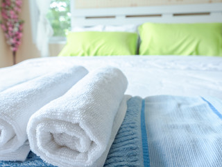 Selected focus on a white towel in the bedroom