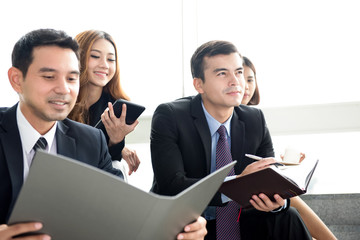 Business people siting in group as audiences in training class