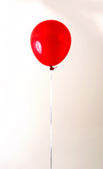 Balloon on an off white background