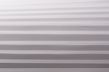 Striped stepped soft white and grey abstract paper texture with halftone perspective.