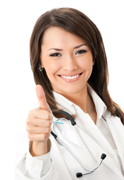 Doctor with thumbs up gesture, over white