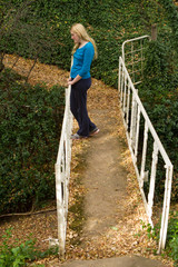 lonely girl on bridge