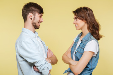 Happy brother and sister over yellow background
