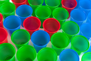 Multicolor plastic glasses isolated on white background