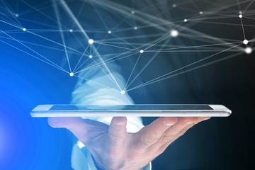 Hand holding tablet with operating system screen and network connection