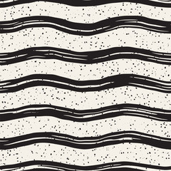 Decorative seamless pattern with hand drawn doodle lines. Hand painted grungy wavy stripes background. Trendy freehand texture