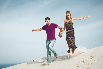 couple running from mountain