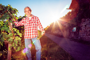 Winemaker Standing By His Vineyard