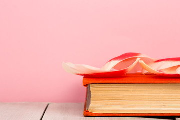 education and reading concept - open book with flower leafs