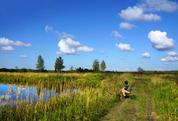 Fisherman on a coast of river