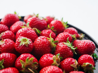 Fresh, ripe, juicy strawberries. Appetizing berries with droplets on a tray