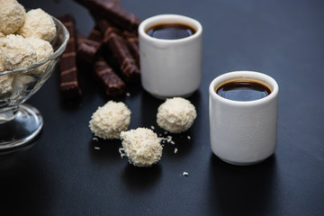 black coffee sweets on a black background