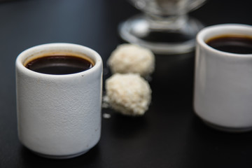black coffee sweets on a black background
