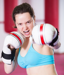 Young sportwoman practicing different kiks