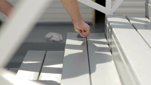 Close-up Wood painting with a brush with the gray color