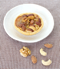 Mixed nuts and a baked dish tart
