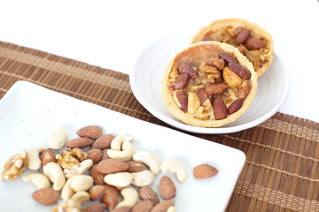 Mixed nuts and a baked dish tart