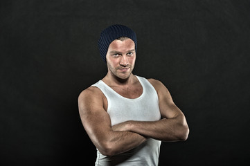 portrait of handsome bearded man in hat on black background