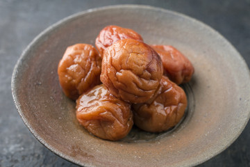 Traditional Japanese Umeboshi as close-up in a bowl