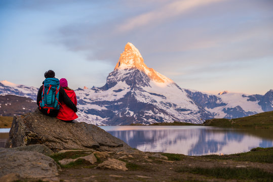 Romantic couple at sunrise, from lake Stellisee, Swiss Alps , Matterhorn Peak, Zermatt, 2017