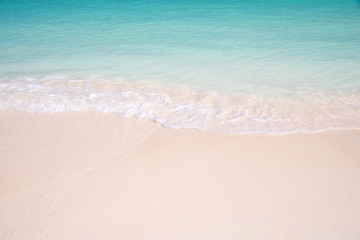 Fototapeta na wymiar Sand and caribbean sea background, tropical beach travel concept