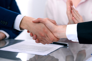 Business people shaking hands finishing up a meeting