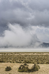 Dramatic evaporation of water on a salt lake. High altitude Salina Salada in Peru. South America.