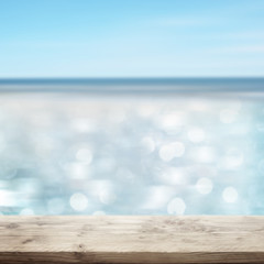 Fototapeta na wymiar Glittering sea with wooden table