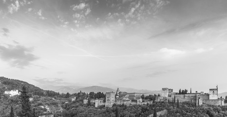 Fototapeta na wymiar Black and white image of landscape of Alhambra of Granada, Spain, from Albaycin with Sierra Nevada's mountain on the background