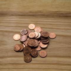 Old Latvian coins on a wooden background