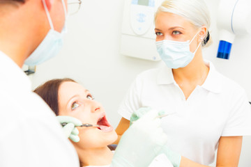 Young Woman Getting A Treatment At The Dentist