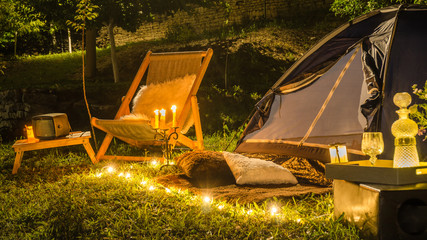 Romantic evening with a tent at night in the yard.