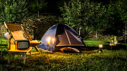 Romantic evening with a tent at night in the yard.