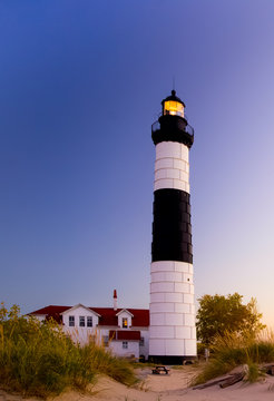 Michigan Lighthouse. Illuminated beacon of the Big Sable Lighthouse on the shores of Lake Michigan in Ludington State Park. 