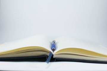 Notebook close-up. Notebook with a pencil on a white background.