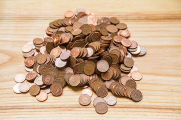 Old Latvian coins on a wooden background