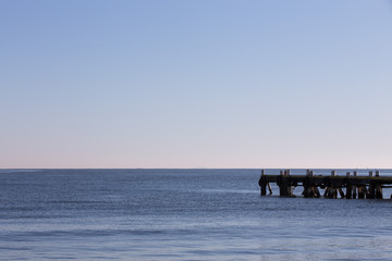 Fototapeta premium View of a pier with mountains on the background