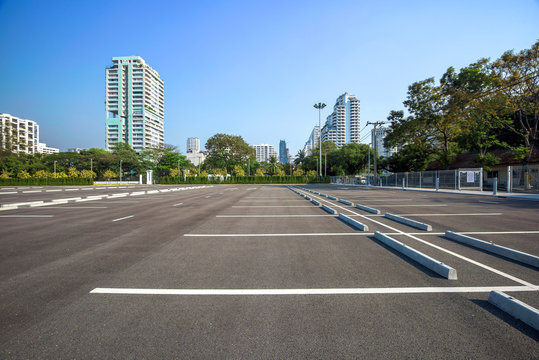 Empty parking lot at city center