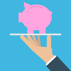 Hand holding piggy bank on a platter