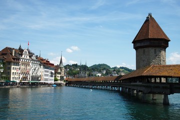 Old wooden bridge with its water tower over the river Reuss in Lucerne, Switzerland