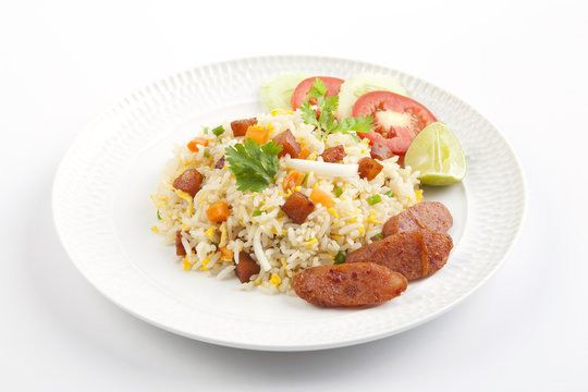 Fried rice with chinese sausage on white plate