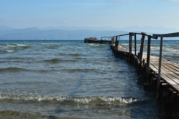Fototapeta na wymiar Old wooden mooring dock for fishing boats, Corfu Island, Greece