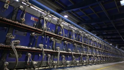 Tunnel kiln for baking ceramic tiles. Production of ceramic tiles. Automated production of ceramic tiles and porcelain tiles. Ceramic tile and porcelain tile production plant from the inside.